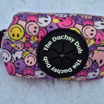 The one with the smiley faces poo bag