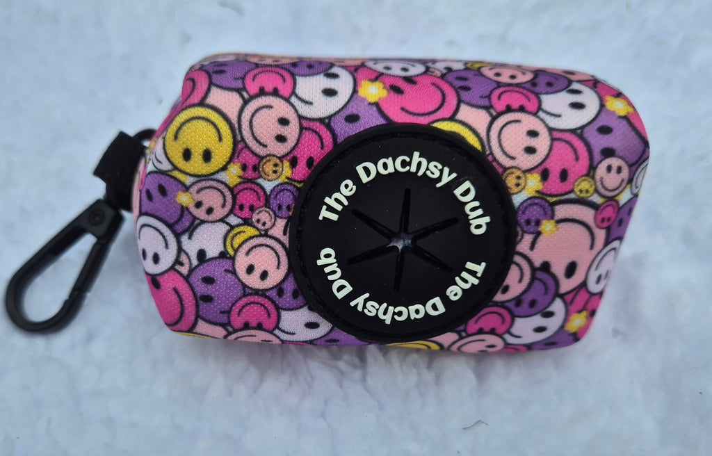 The one with the smiley faces poo bag